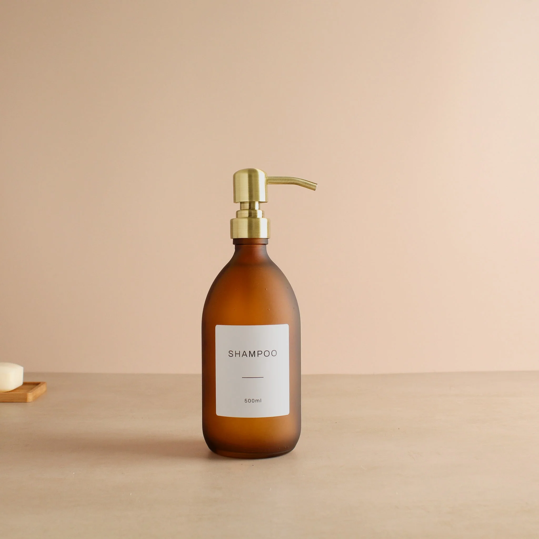 Labelled Frosted Amber Glass Dispenser Bottle With Gold Pump - Image 4