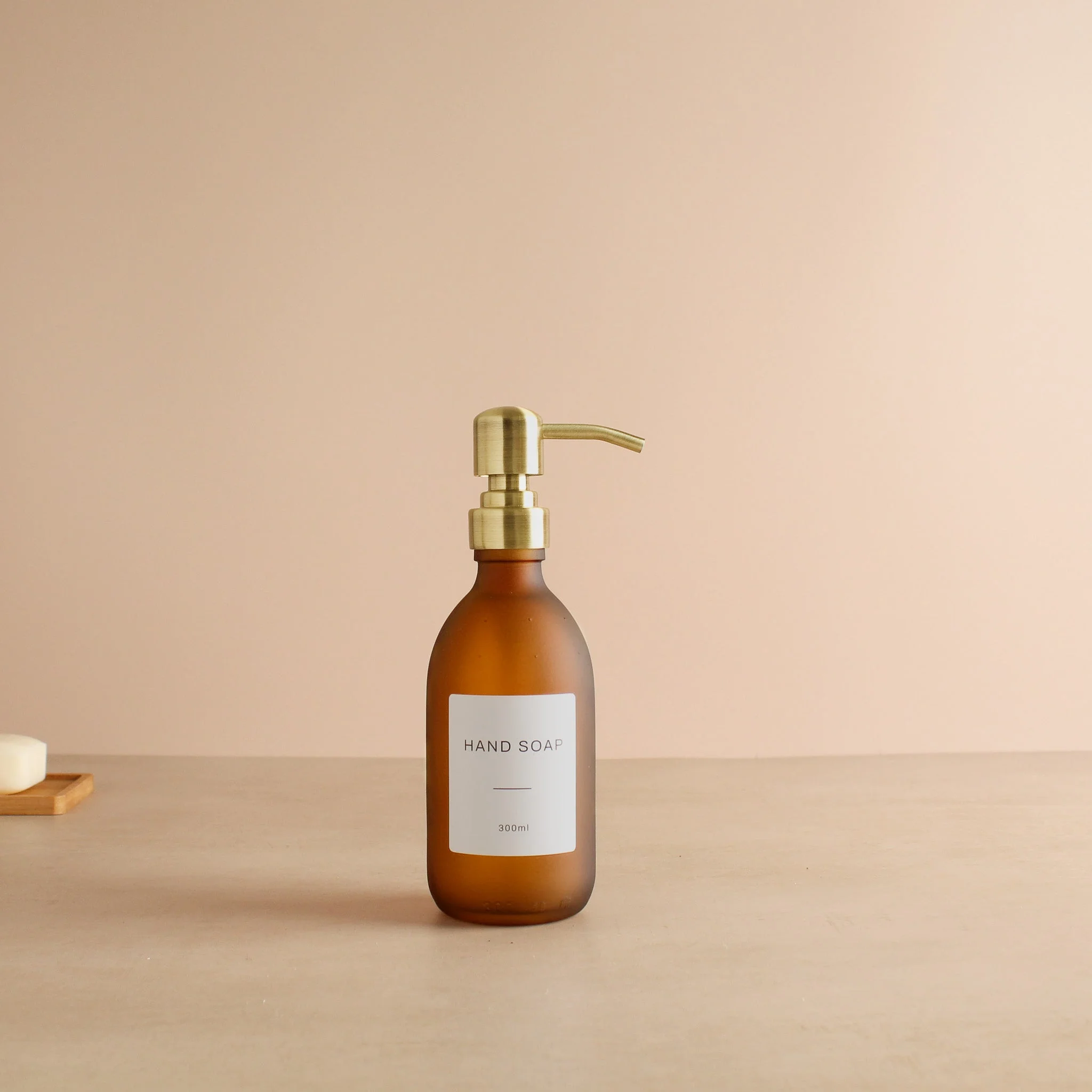 Labelled Frosted Amber Glass Dispenser Bottle With Gold Pump - Image 5