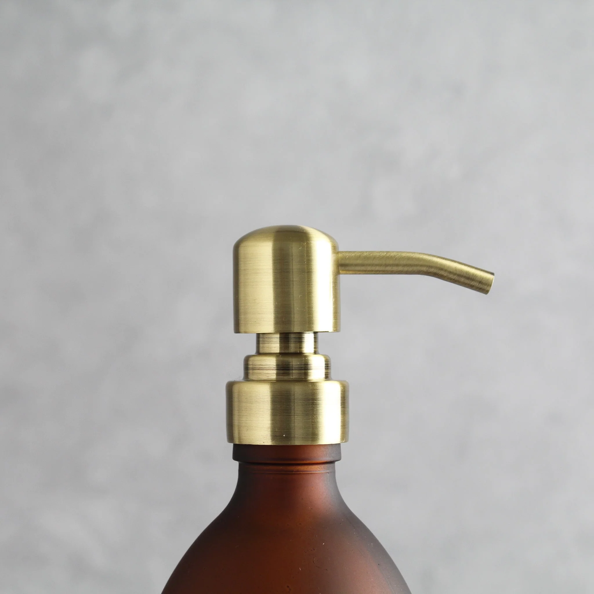 Labelled Frosted Amber Glass Dispenser Bottle With Gold Pump - Image 6