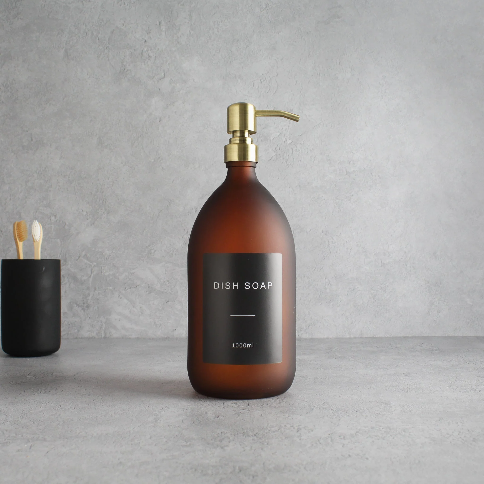 Labelled Frosted Amber Glass Dispenser Bottle With Gold Pump - Image 3