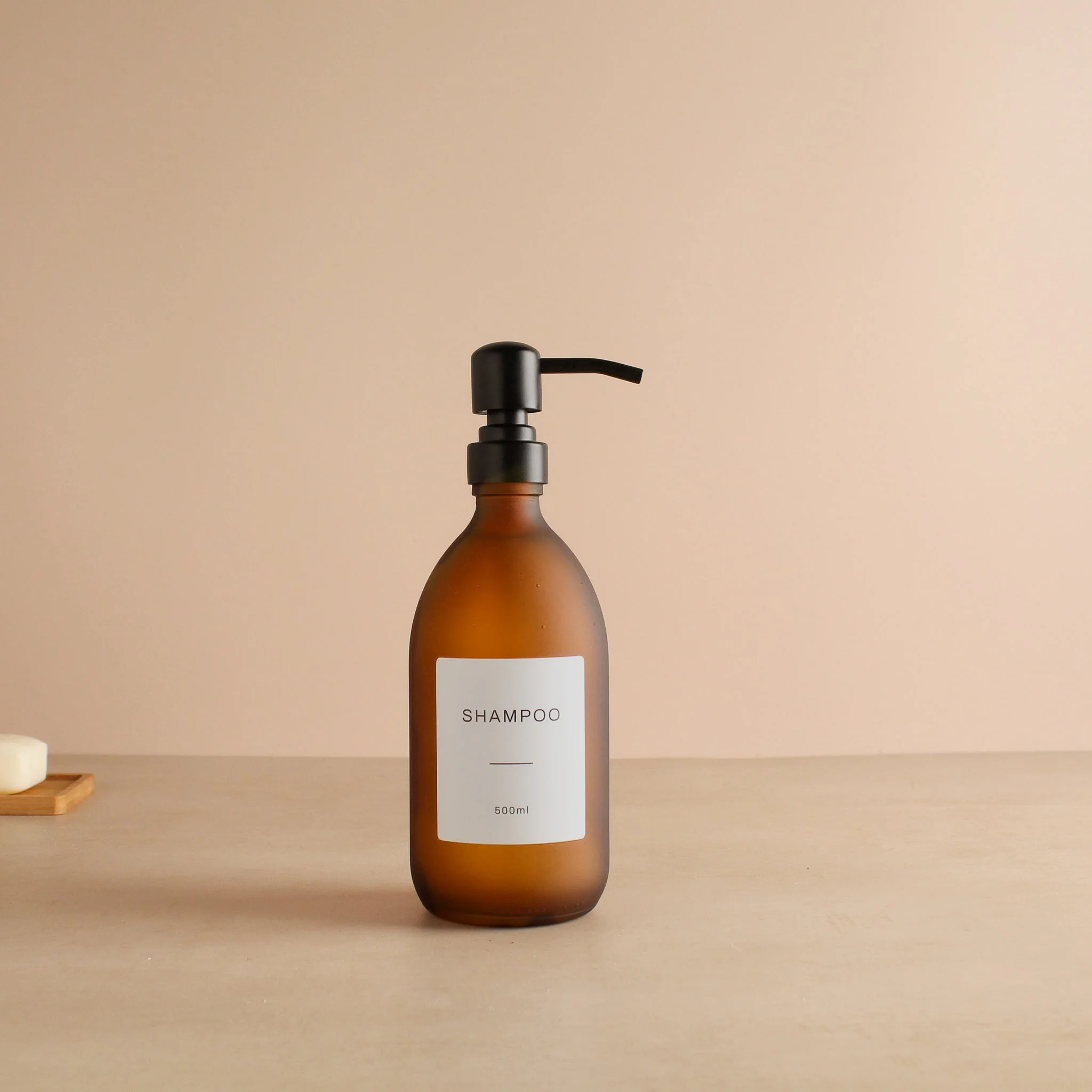 Labelled Frosted Amber Glass Dispenser Bottle With Matte Black Pump - Image 4