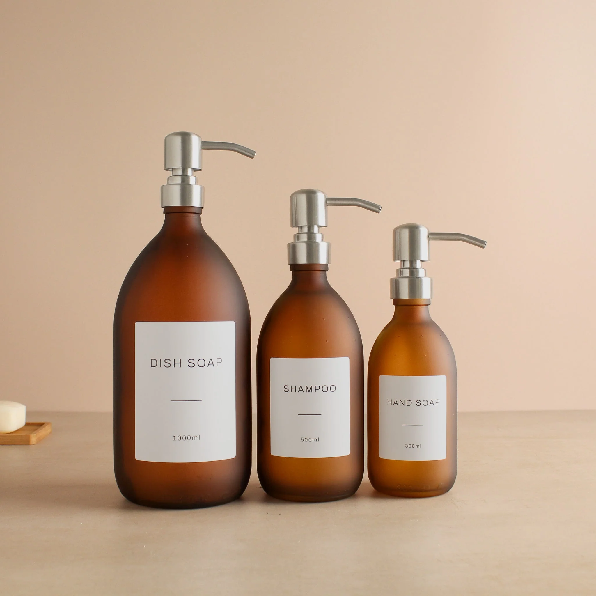 Labelled Frosted Amber Glass Dispenser Bottle With Silver Pump - Image 2