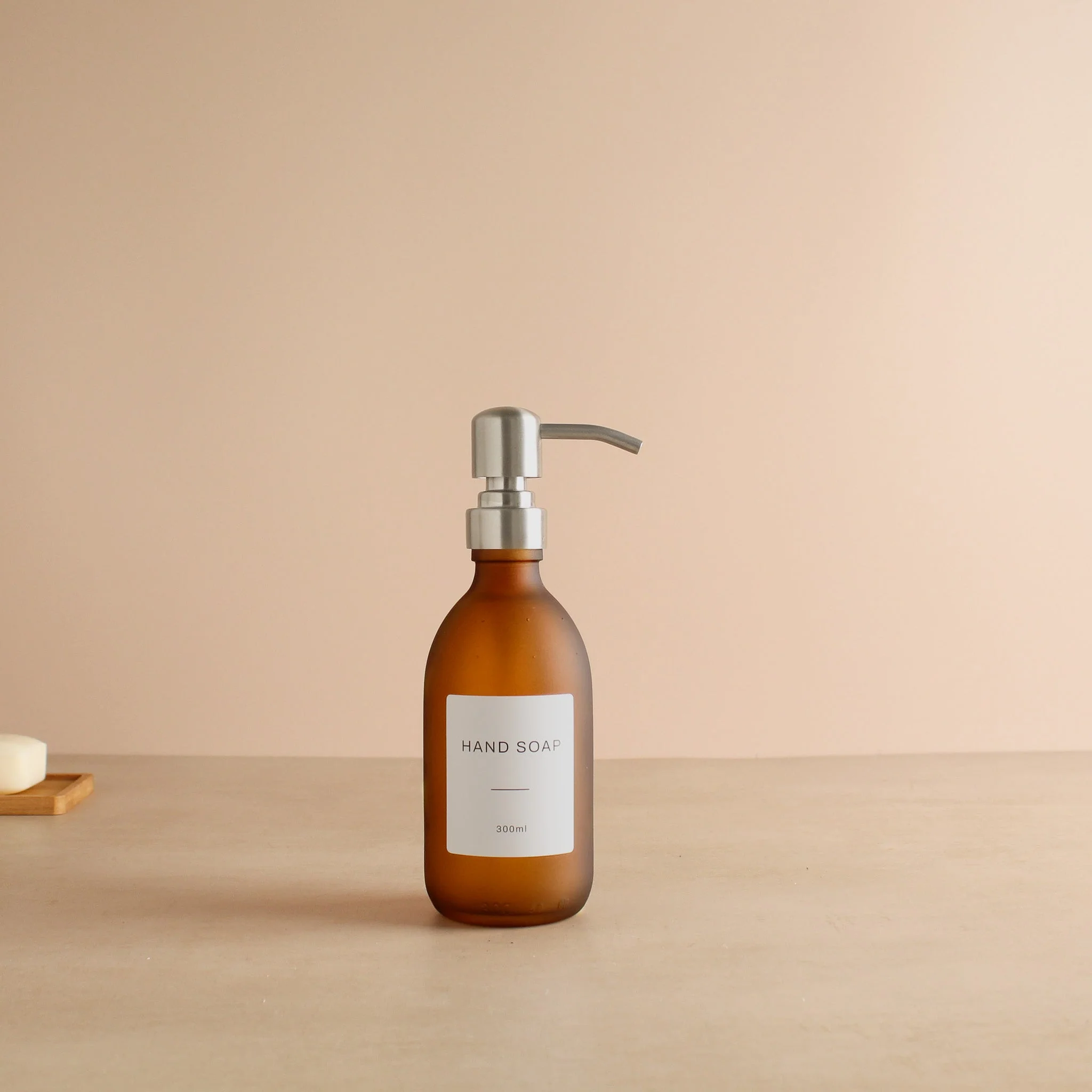 Labelled Frosted Amber Glass Dispenser Bottle With Silver Pump - Image 5