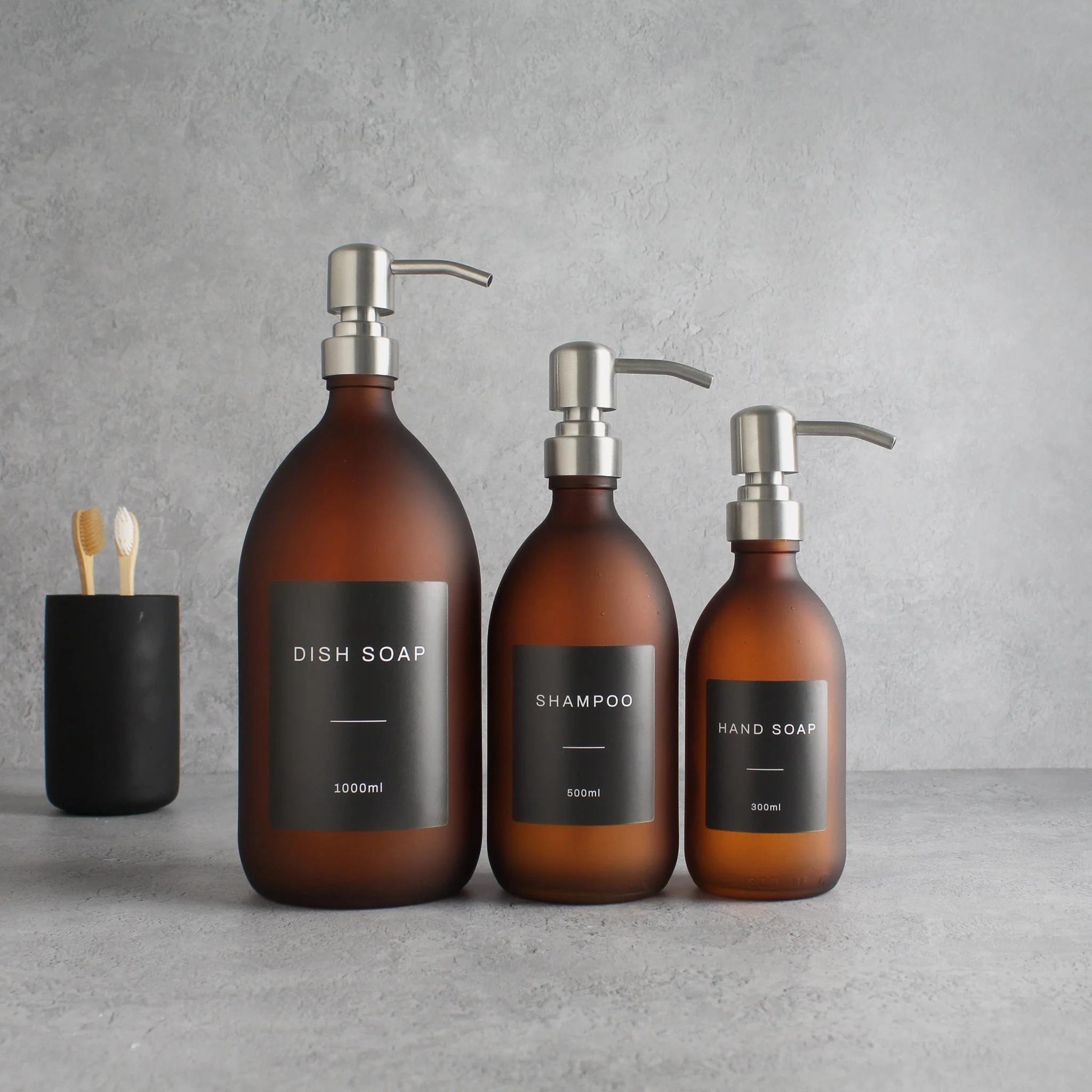 Labelled Frosted Amber Glass Dispenser Bottle With Silver Pump - Image 2