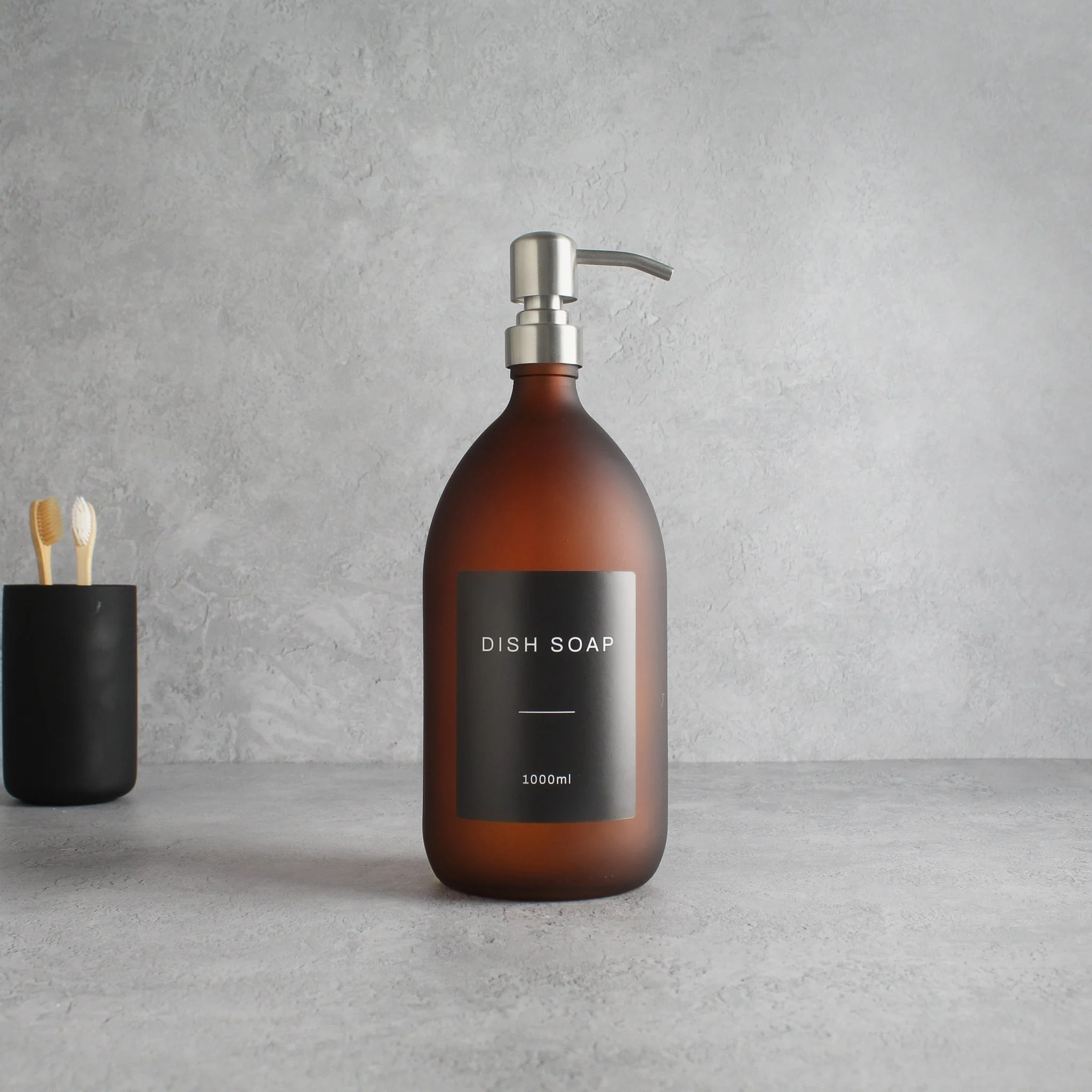 Labelled Frosted Amber Glass Dispenser Bottle With Silver Pump - Image 3