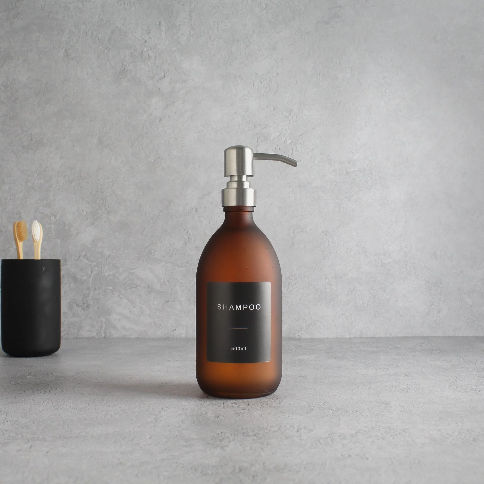 Labelled Frosted Amber Glass Dispenser Bottle With Silver Pump - Image 4