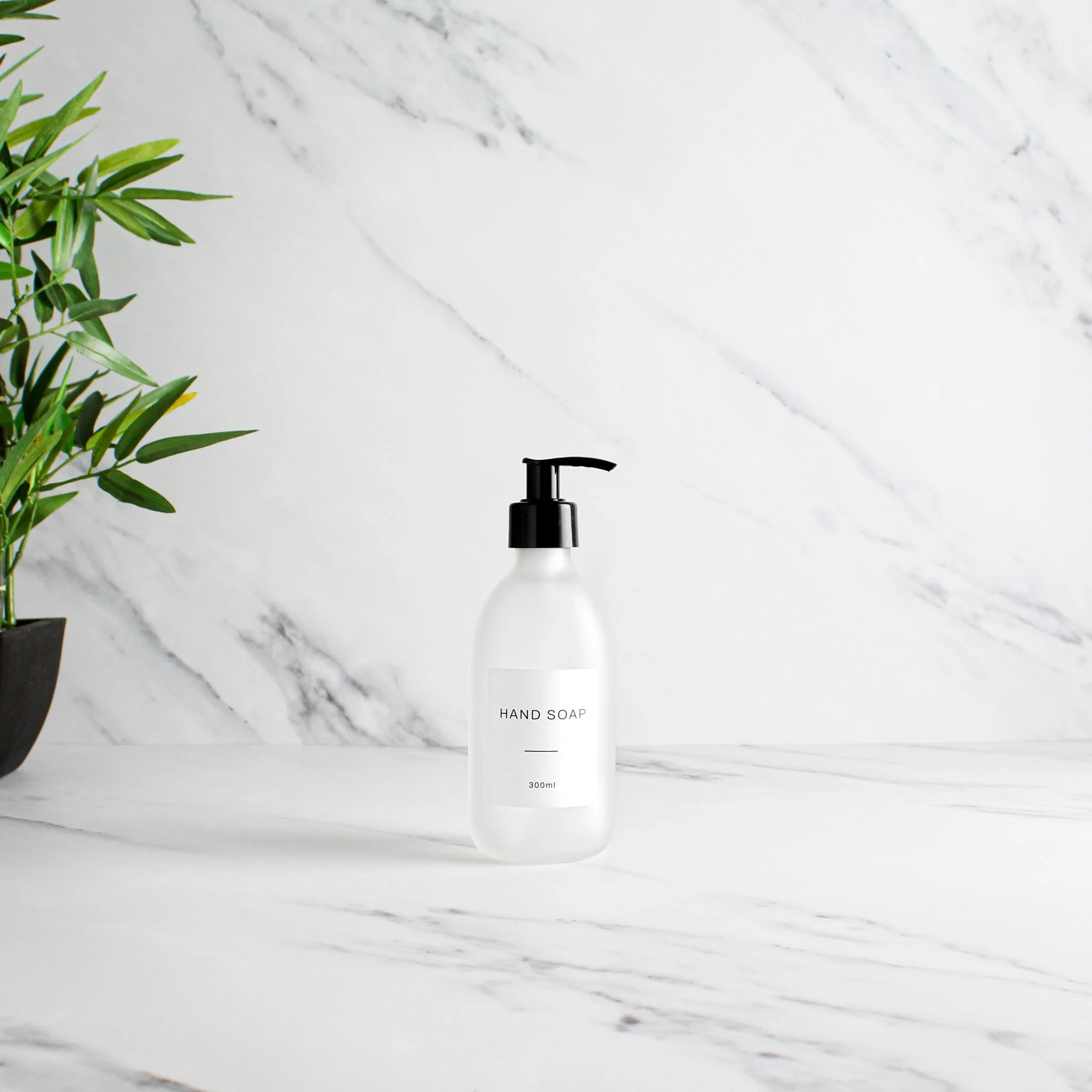 Labelled Frosted White Glass Dispenser Bottle With Black Pump - Image 5