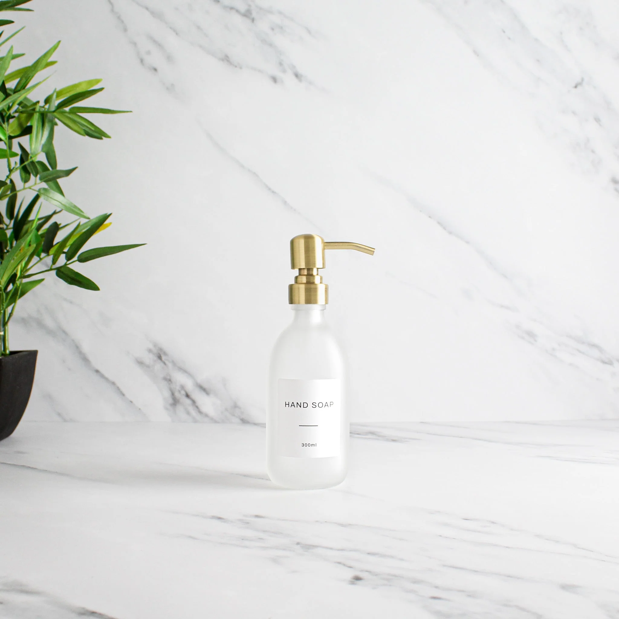 Labelled Frosted White Glass Dispenser Bottle With Gold Pump - Image 5