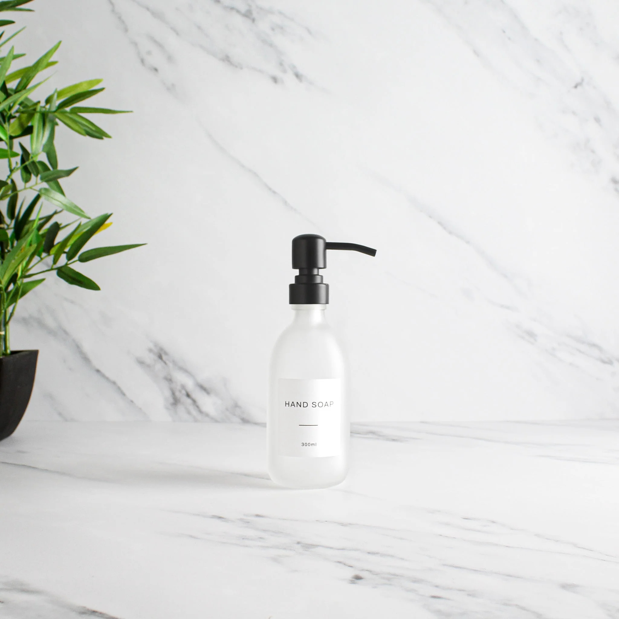 Labelled Frosted White Glass Dispenser Bottle With Matte Black Pump - Image 3