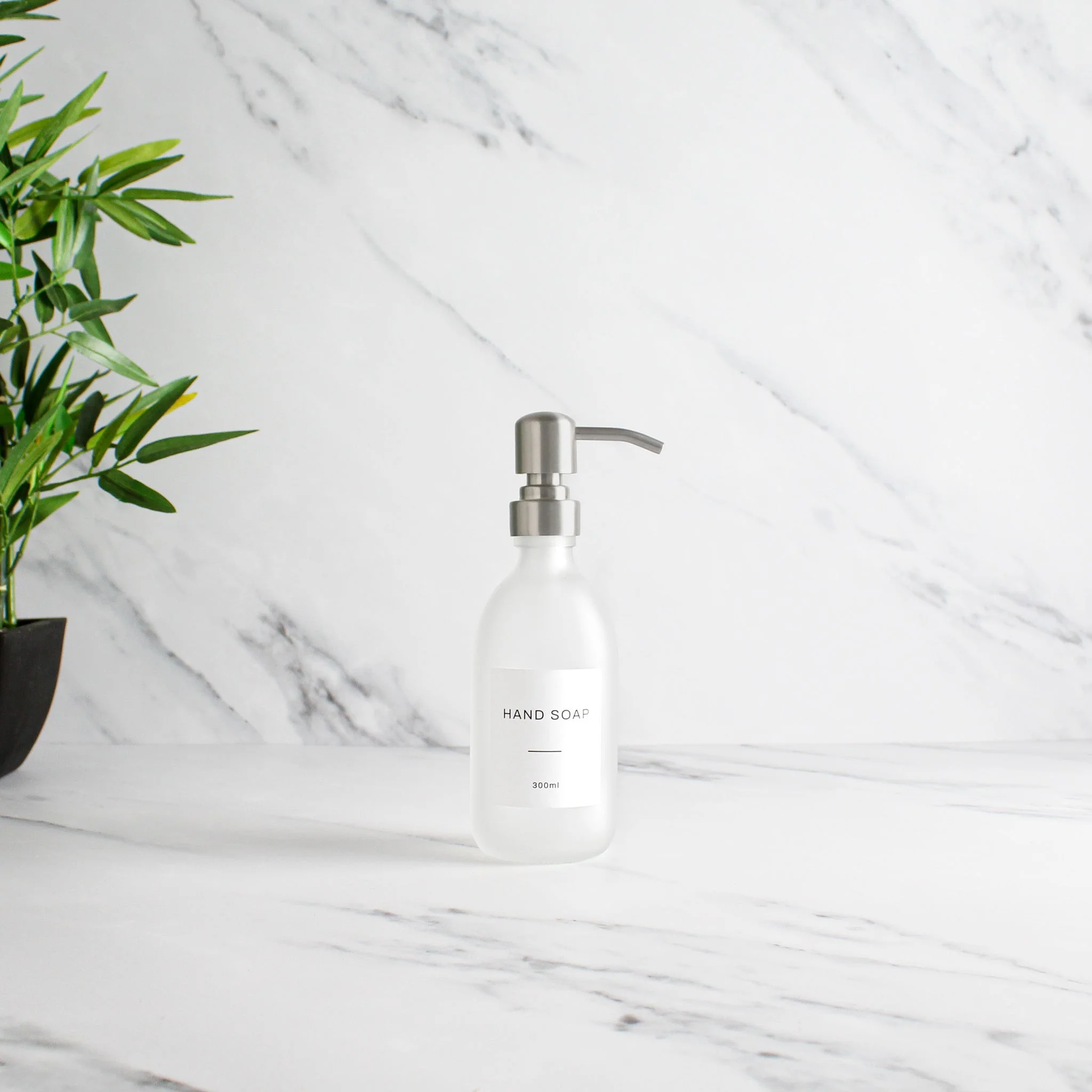Labelled Frosted White Glass Dispenser Bottle With Silver Pump - Image 3