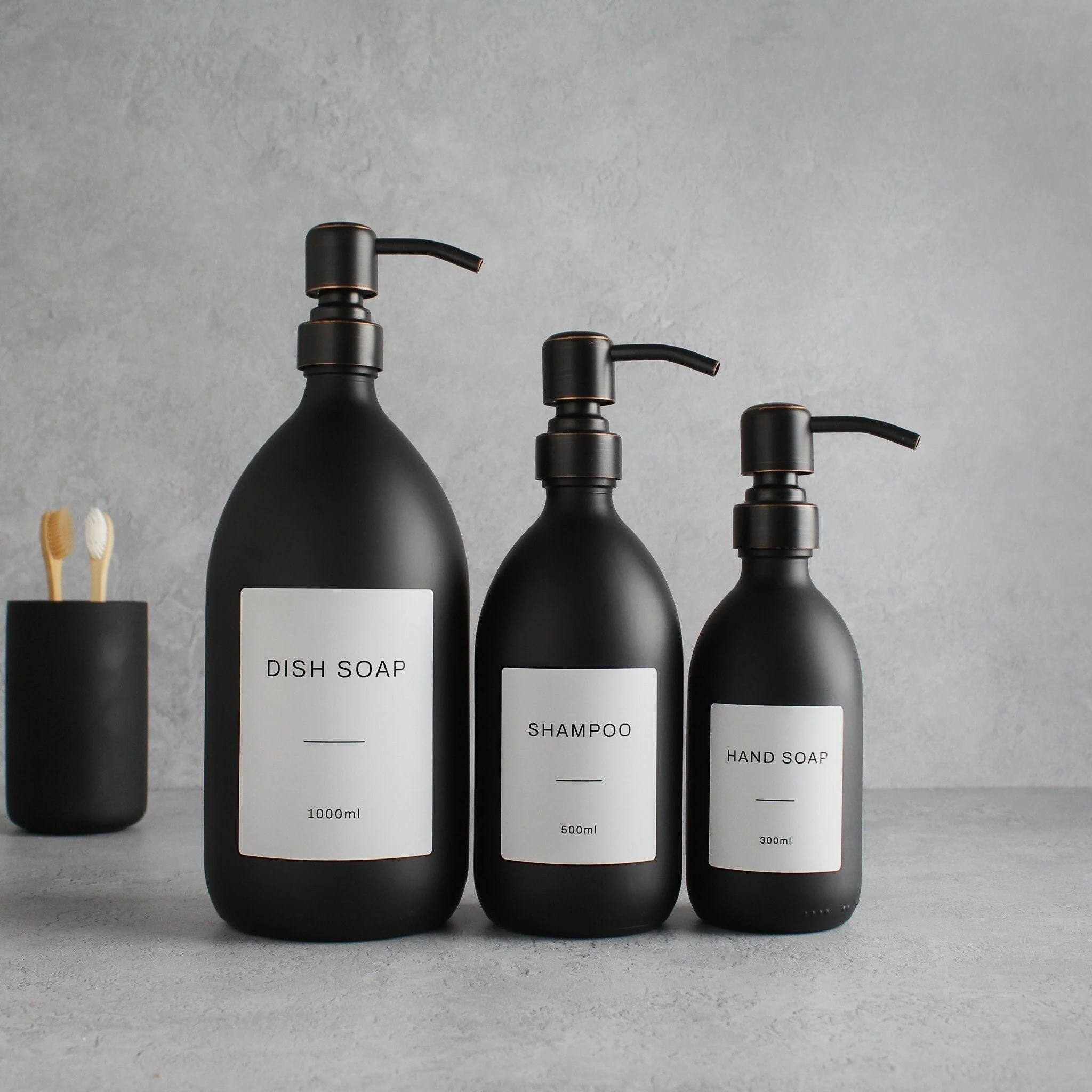 Labelled Matte Black Glass Dispenser Bottle With Black/Copper Pump - Image 2