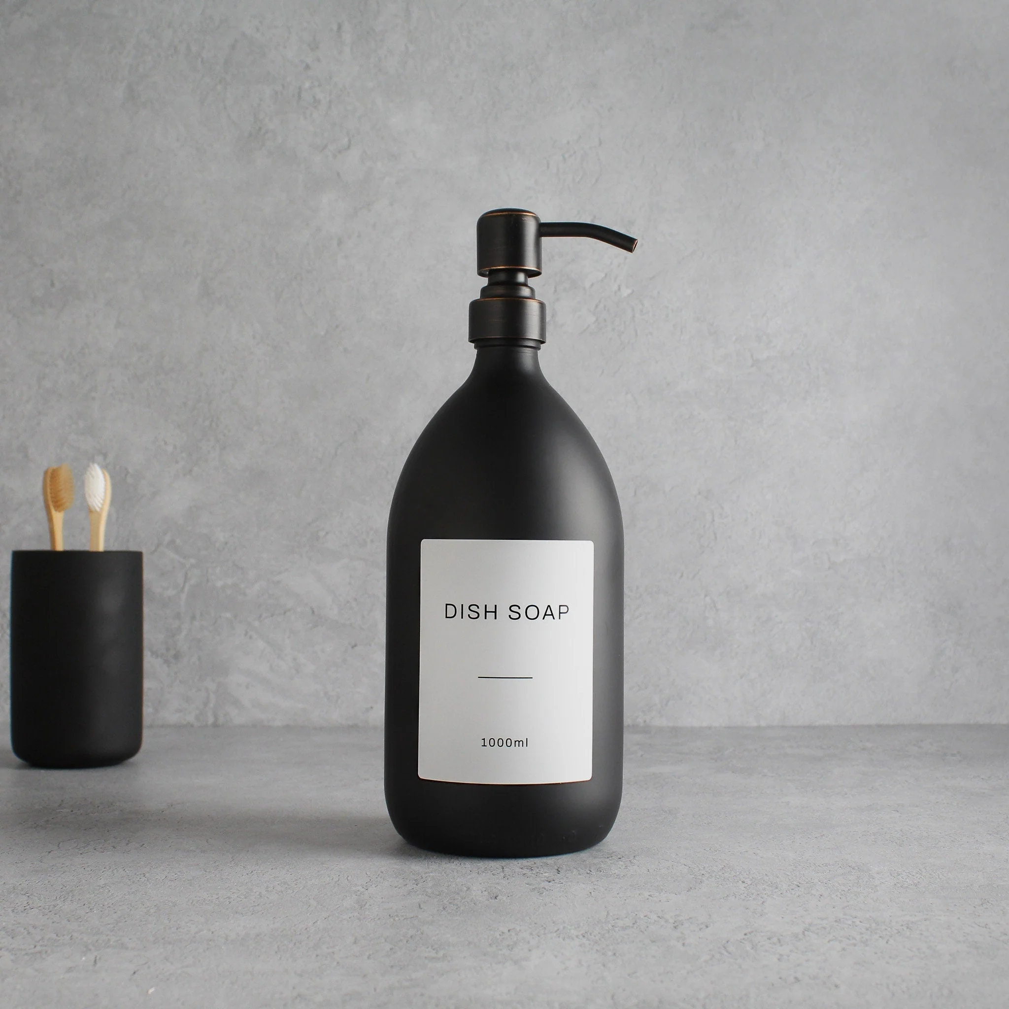 Labelled Matte Black Glass Dispenser Bottle With Black/Copper Pump - Image 3