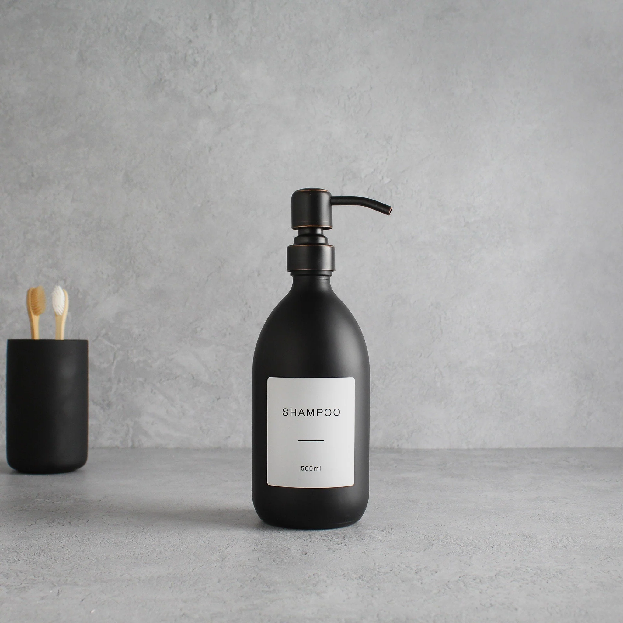 Labelled Matte Black Glass Dispenser Bottle With Black/Copper Pump - Image 4