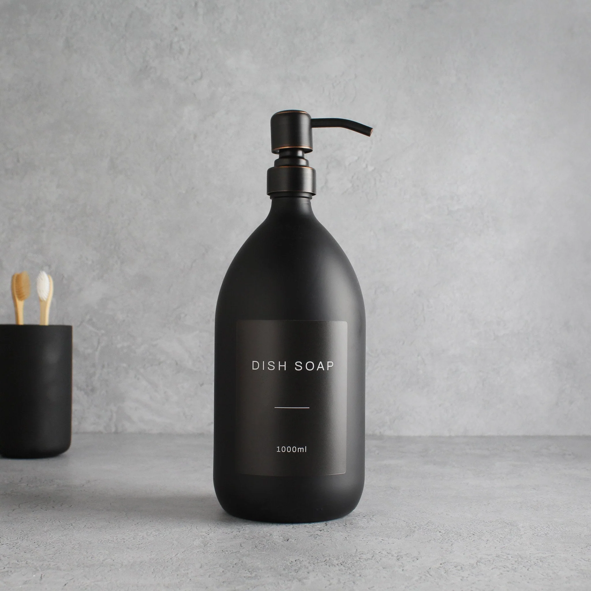 Labelled Matte Black Glass Dispenser Bottle With Black/Copper Pump - Image 3