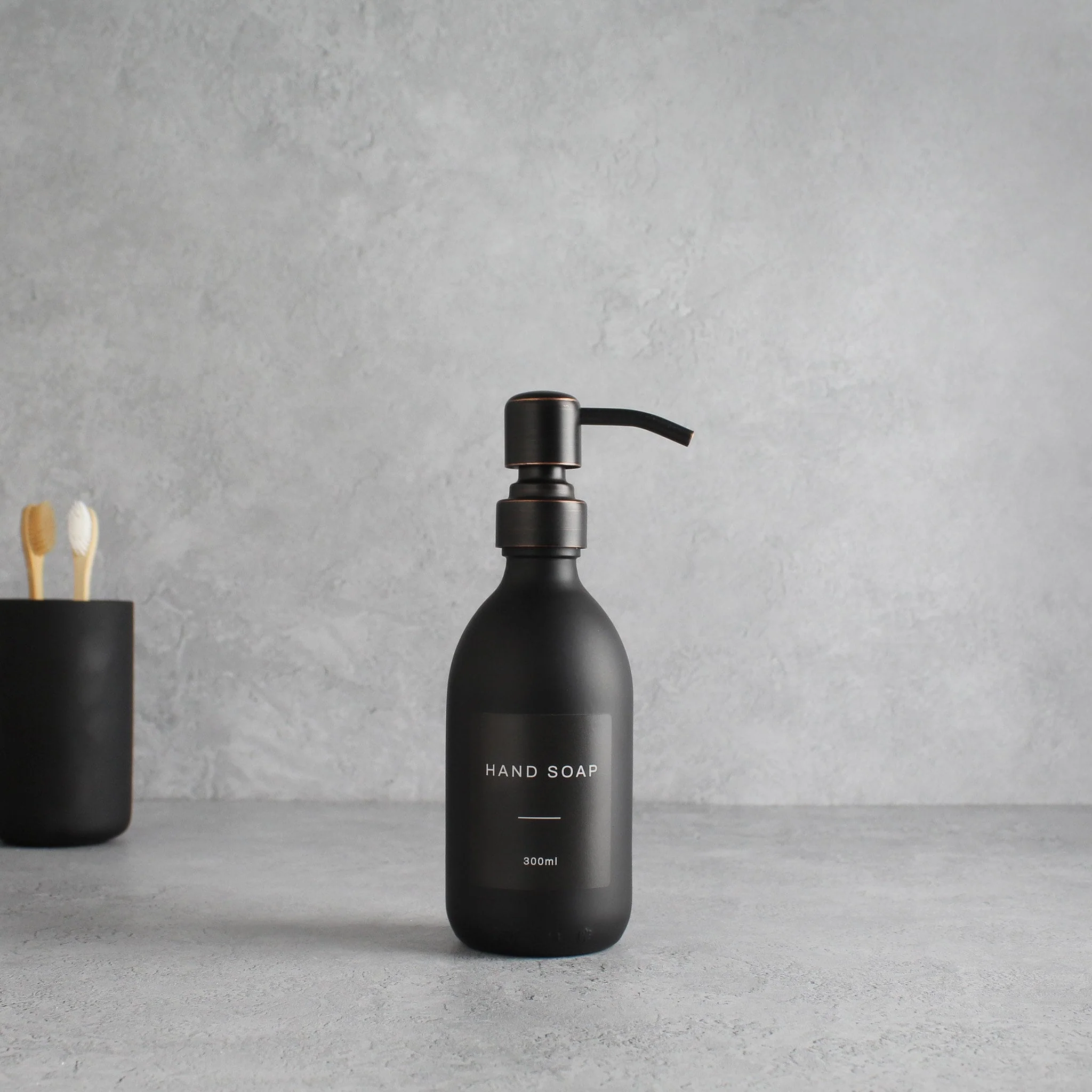 Labelled Matte Black Glass Dispenser Bottle With Black/Copper Pump - Image 5