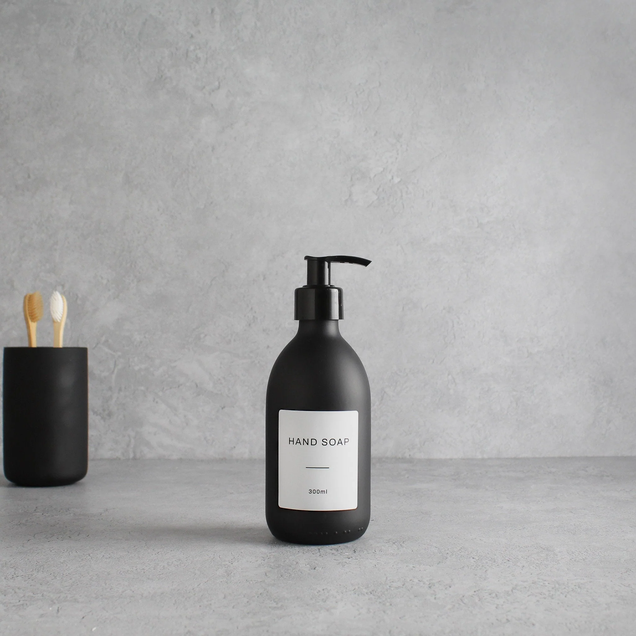 Labelled Matte Black Glass Dispenser Bottle With Black Pump - Image 5