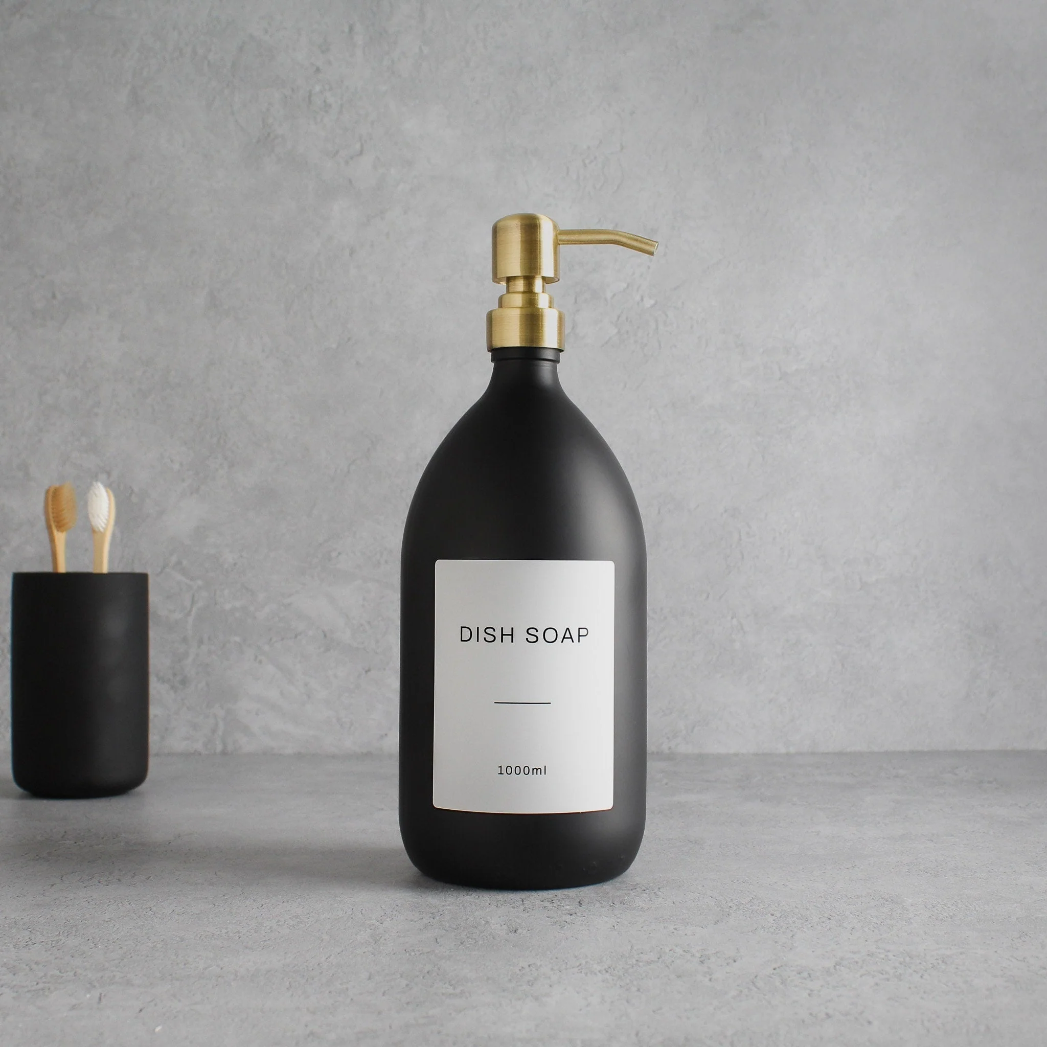 Labelled Matte Black Glass Dispenser Bottle With Gold Pump - Image 3