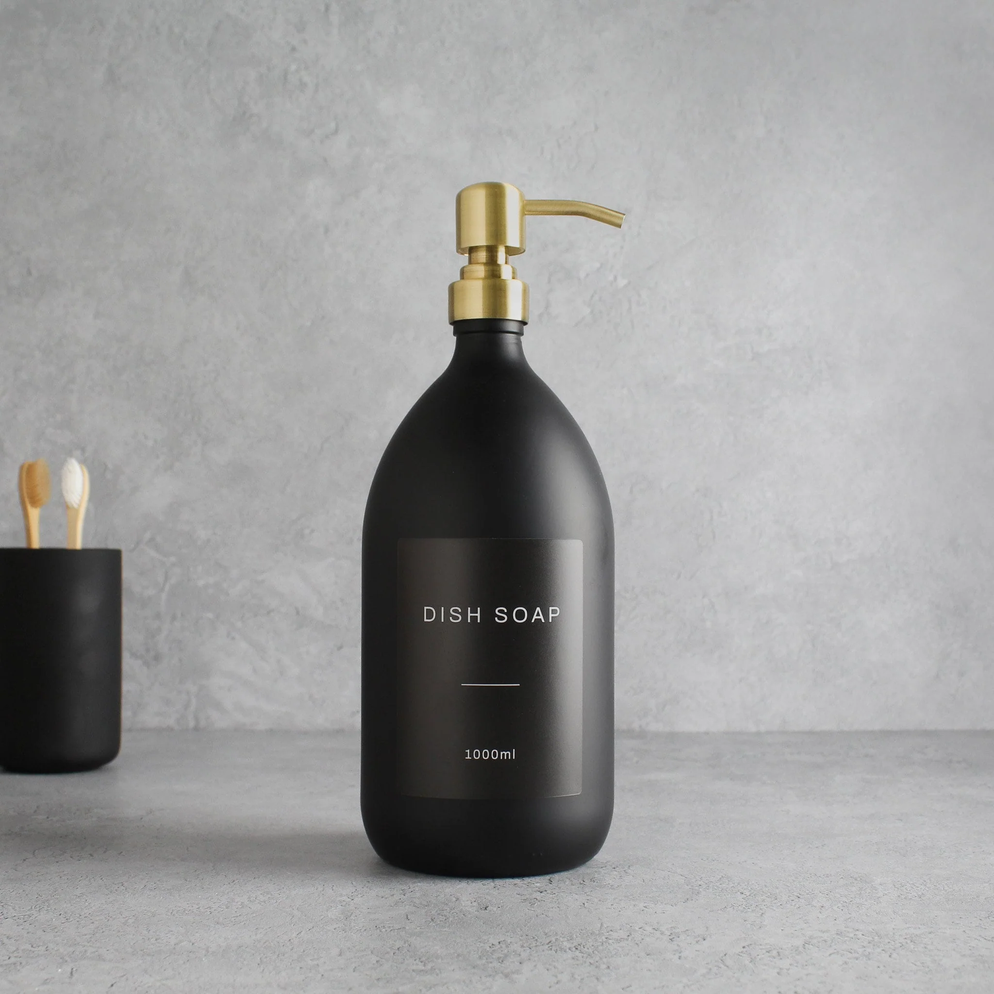 Labelled Matte Black Glass Dispenser Bottle With Gold Pump - Image 3