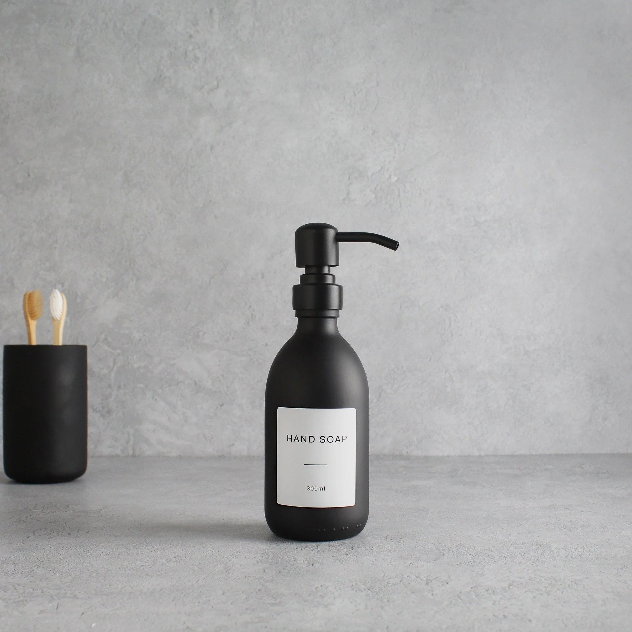 Labelled Matte Black Glass Dispenser Bottle With Matte Black Pump - Image 9
