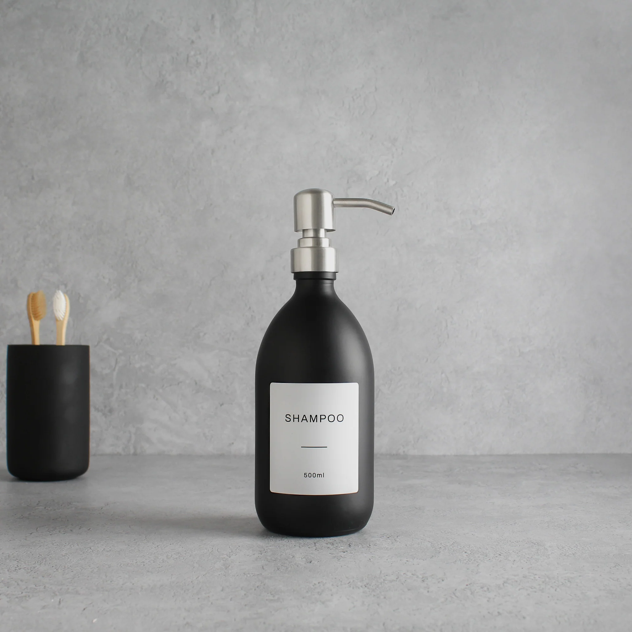 Labelled Matte Black Glass Dispenser Bottle With Silver Pump - Image 3