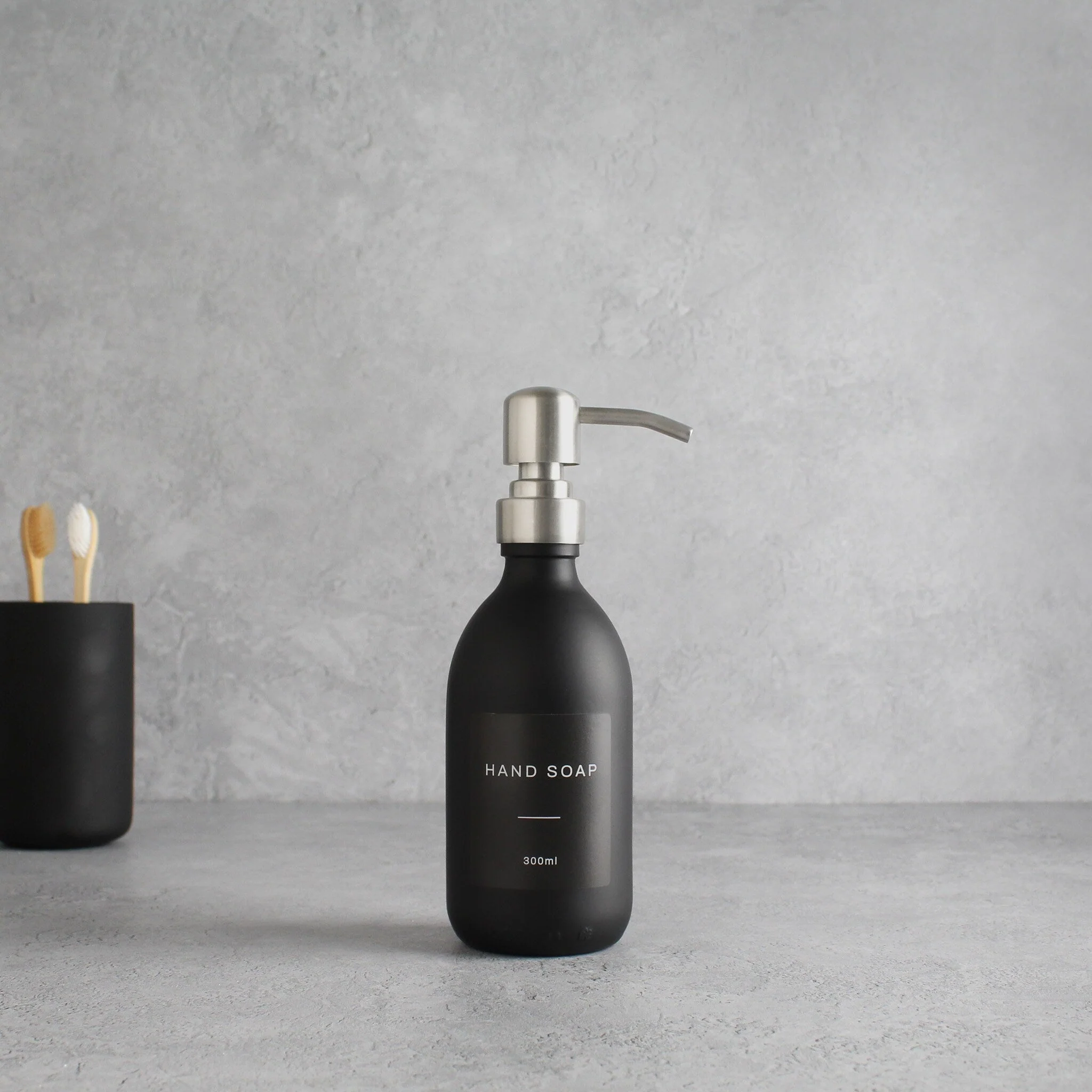 Labelled Matte Black Glass Dispenser Bottle With Silver Pump - Image 5