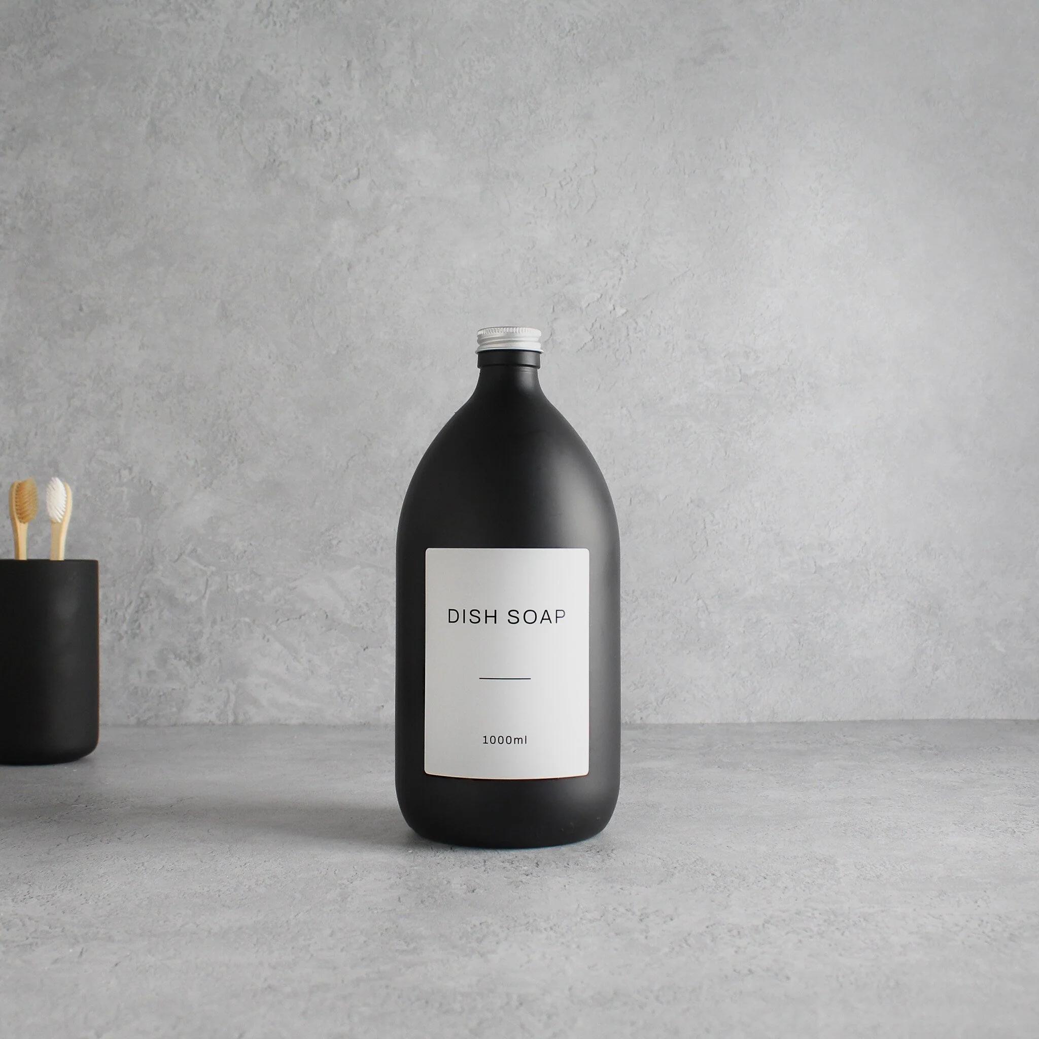 Labelled Matte Black Glass Bottle With Screw Cap - Image 3