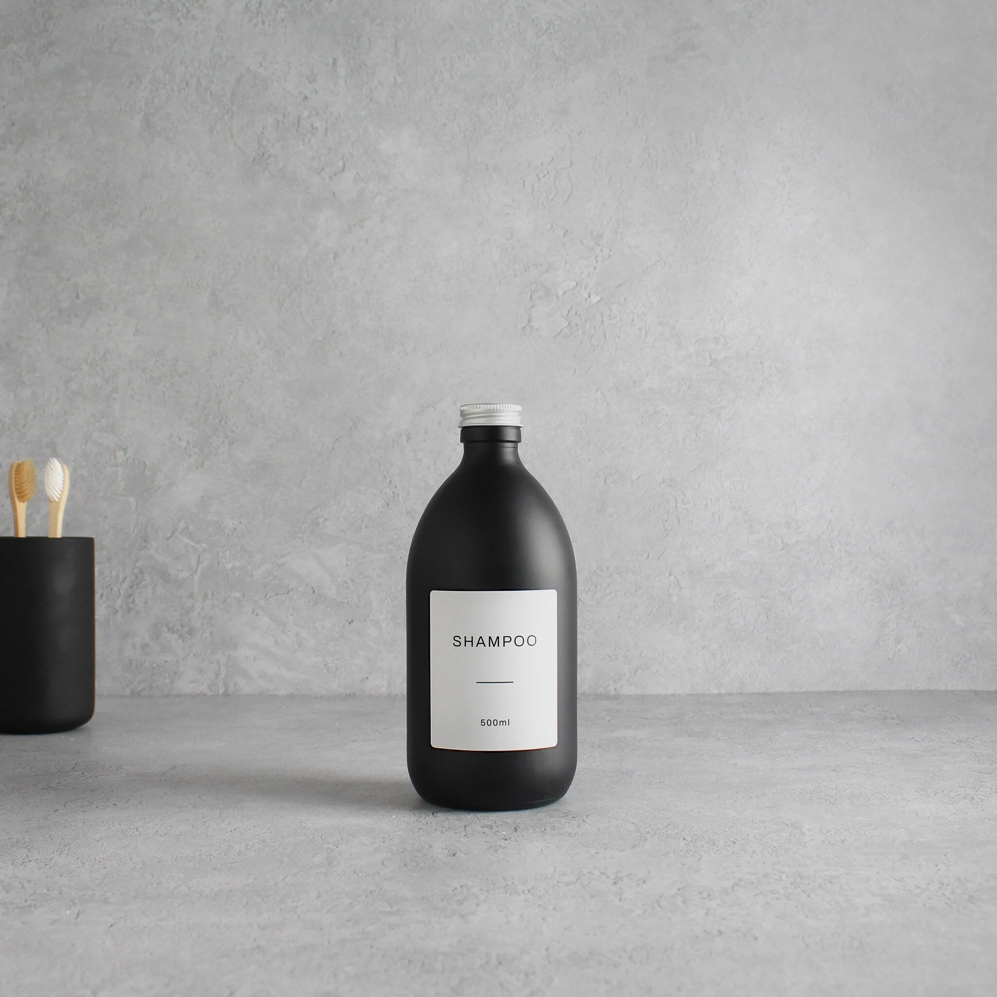 Labelled Matte Black Glass Bottle With Screw Cap - Image 4
