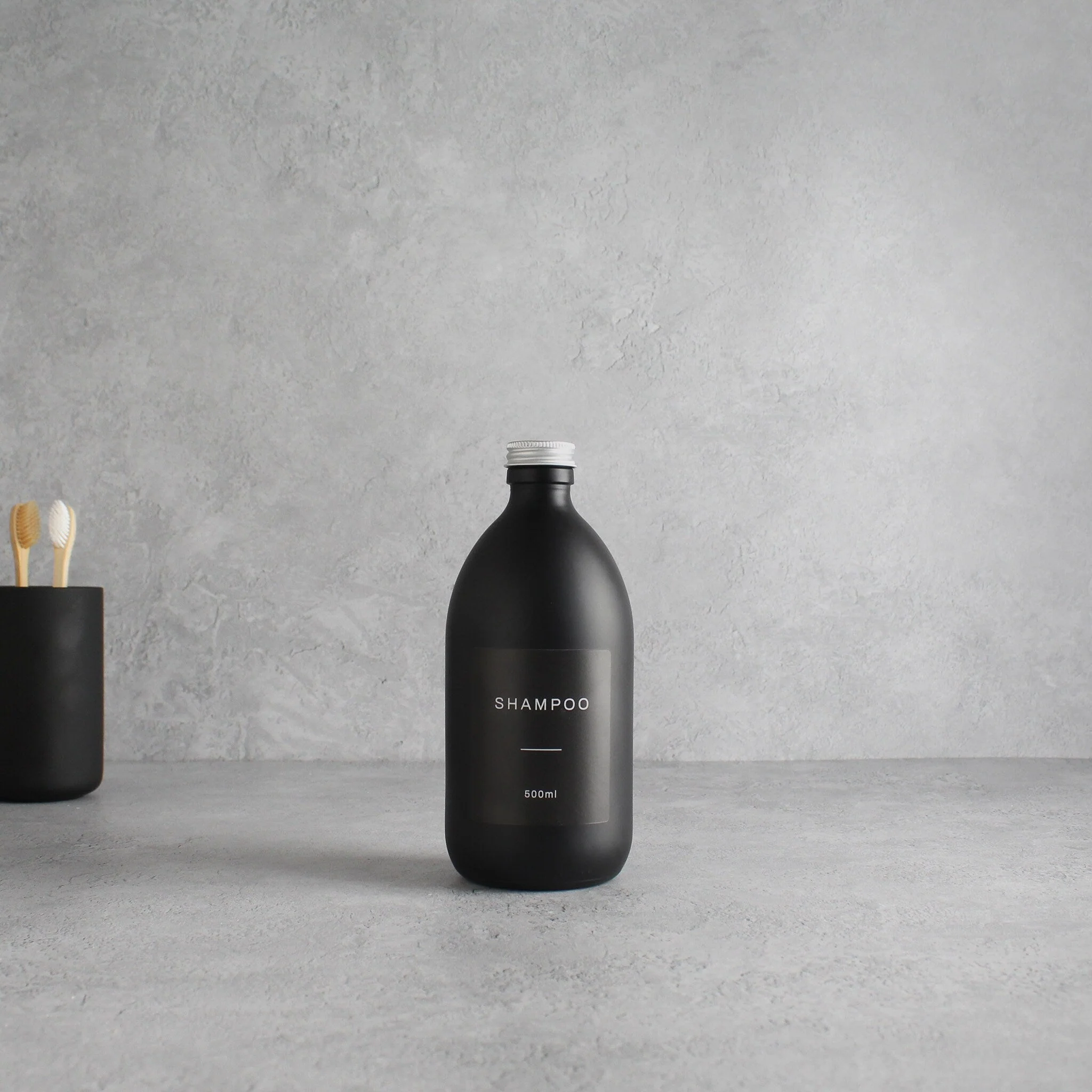Labelled Matte Black Glass Bottle With Screw Cap - Image 4