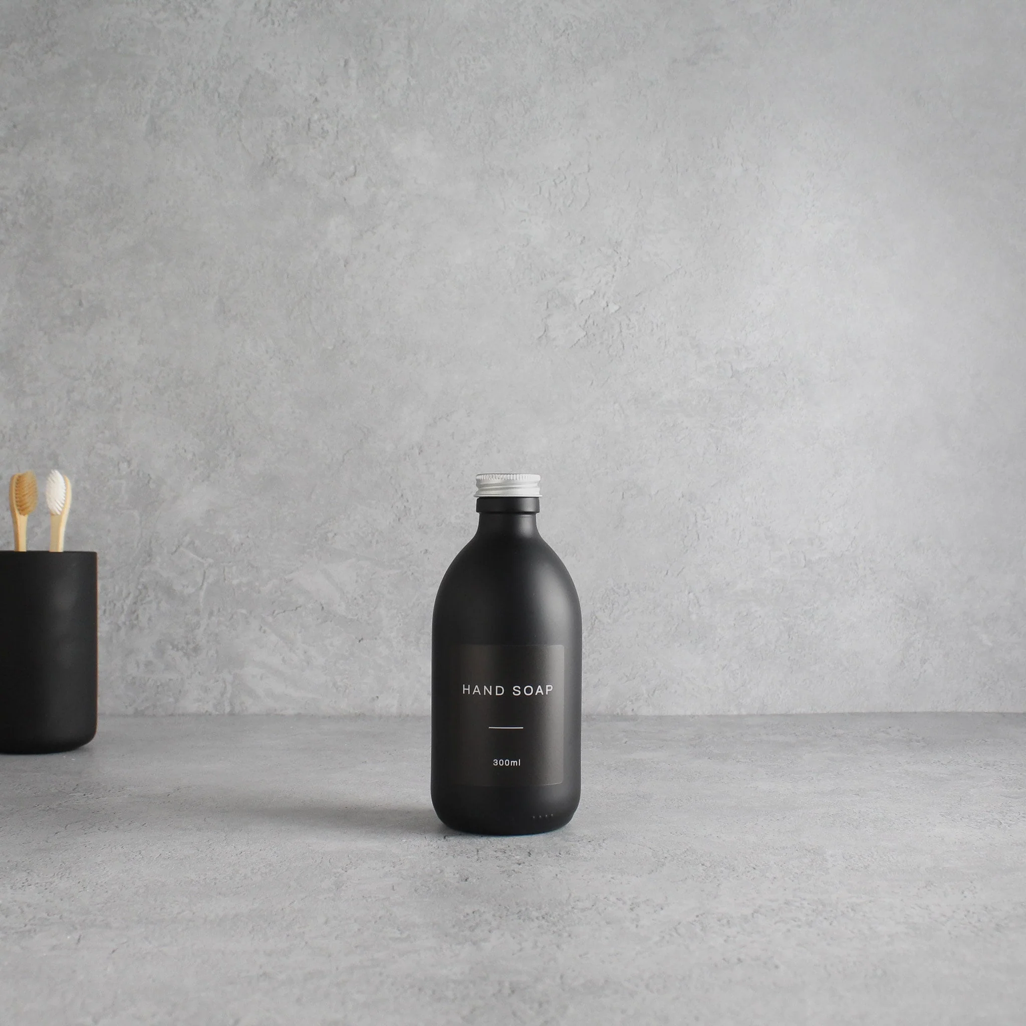 Labelled Matte Black Glass Bottle With Screw Cap - Image 5